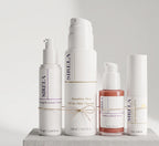 Sirela Complete Protocol — the four-product daily ritual (Cleanser, Peptide Serum, Renewal Cream, Mineral SPF 50) tied together with twine on a stone pedestal