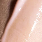 Close-up of a smooth, beige-colored skin texture